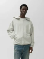 Model wearing A.pressse Vintage Attached Snap Hood Sweat Parka Oatmeal side view
