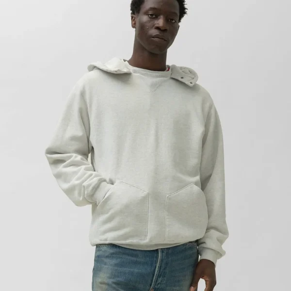 Model wearing A.pressse Vintage Attached Snap Hood Sweat Parka Oatmeal side view