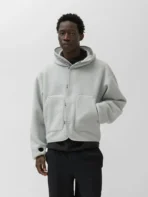 Model wearing A.pressse Wool Fleece Hoodie Natural Gray side view